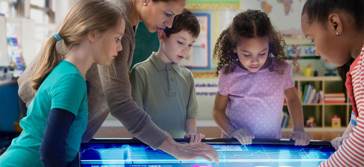 Children using large digital touchscreen display