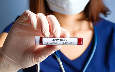 Researcher holding 2019-nCOV sample